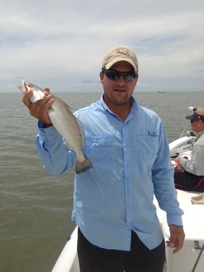 catching-a-nice-size-speckled-trout-salty-south-fishing-charters